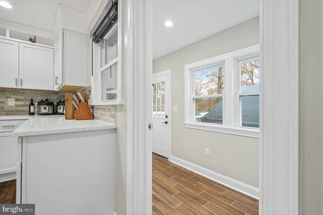 a bathroom with a toilet a sink and shower