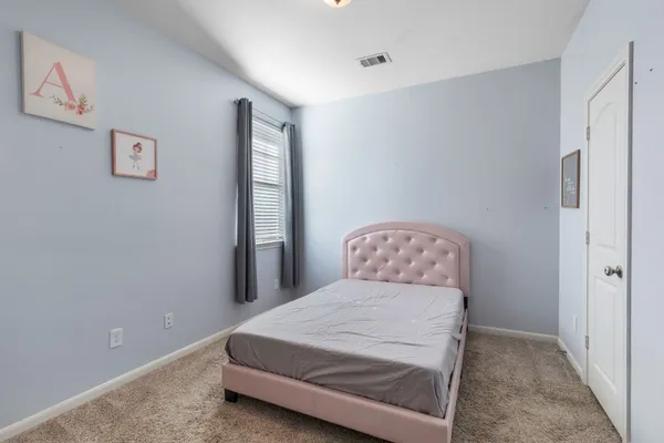 a en suite bathroom with a sink and a mirror