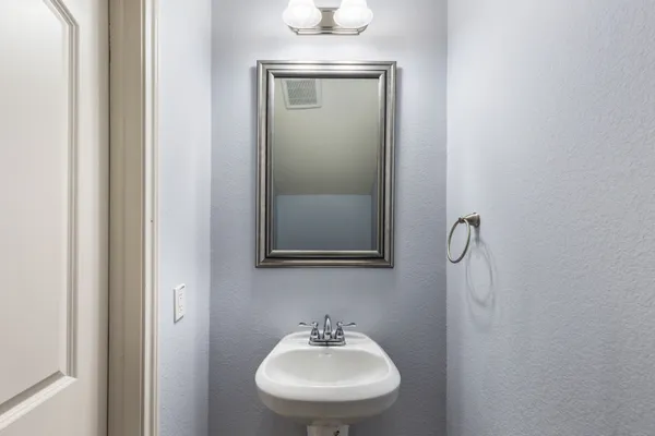 a view of a dining room with furniture and windows
