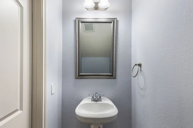 a view of a dining room with furniture and windows