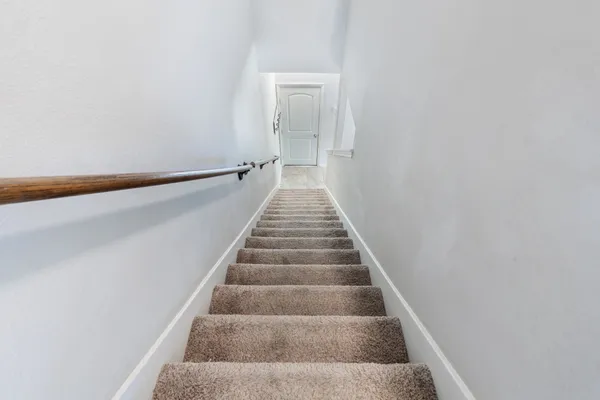 a bathroom with a sink a light fixture and a mirror