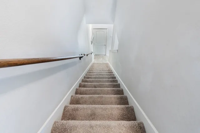 a bathroom with a sink a light fixture and a mirror