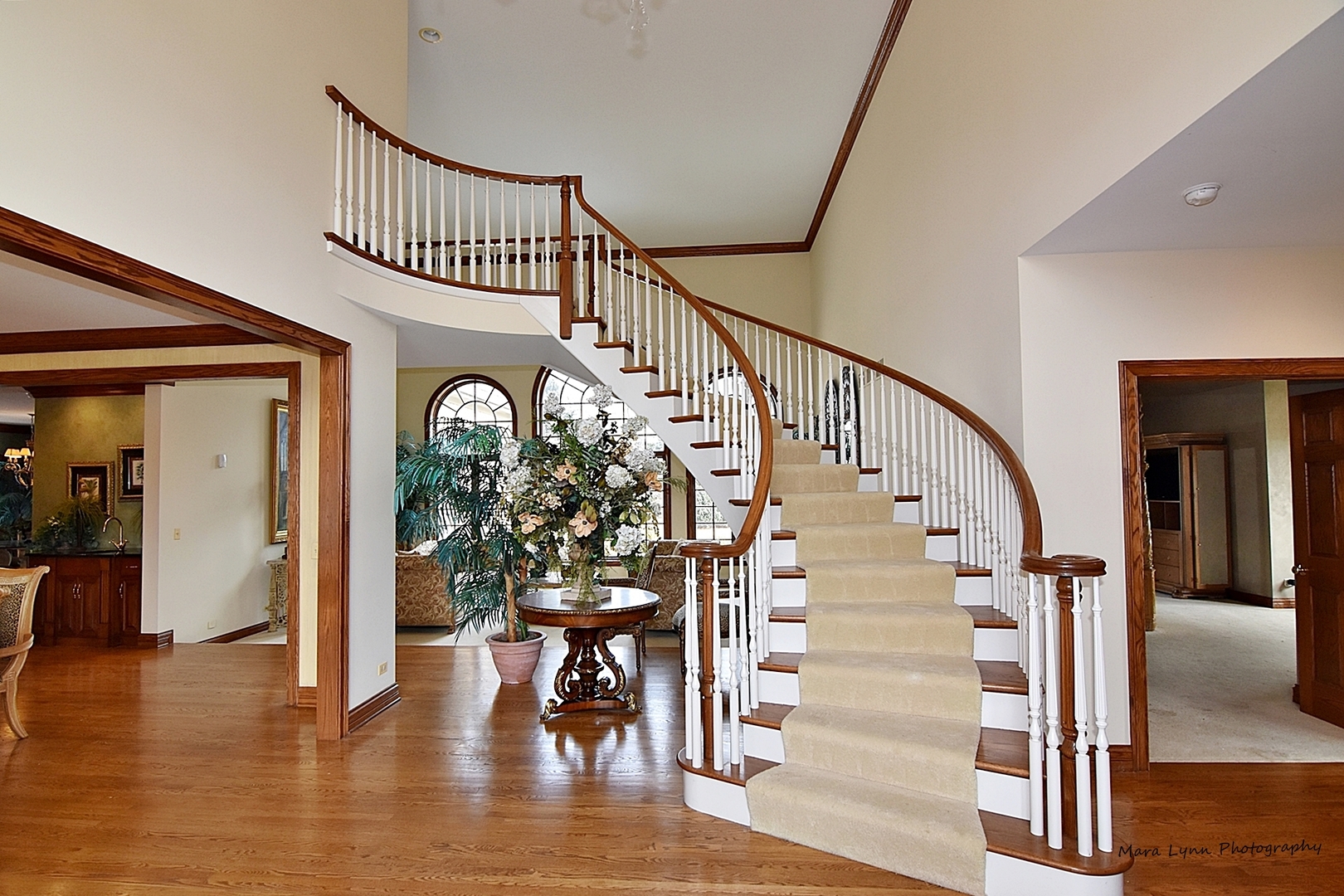 36W623 Lancaster Road St. Charles, IL 60175 - Photo 2 of 20 a view of staircase with furniture and wooden floor