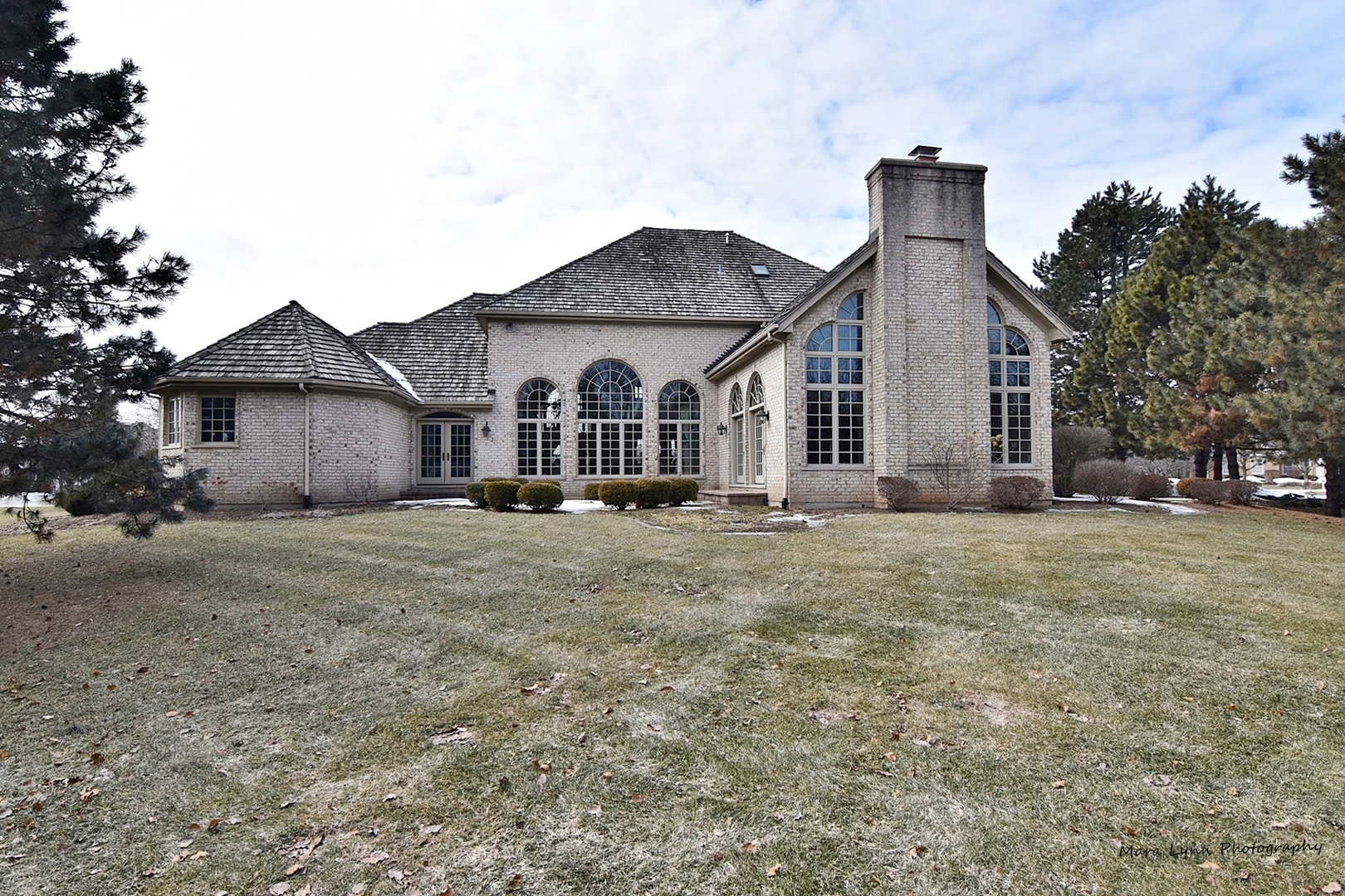 36W623 Lancaster Road St. Charles, IL 60175 - Photo 18 of 20 a front view of a house with a garden