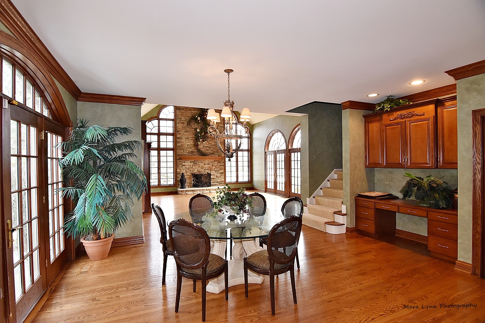 36W623 Lancaster Road St. Charles, IL 60175 - Photo 7 of 20 a dining room with furniture potted plants and wooden floor