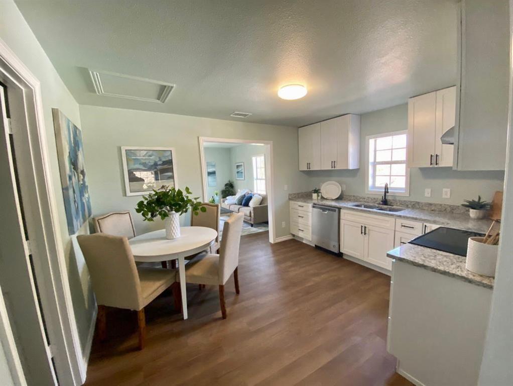 a kitchen with a table and chairs in it