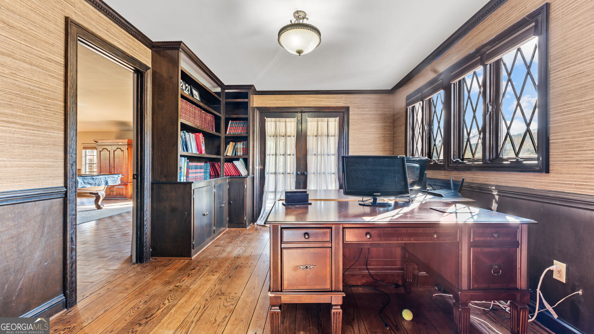 8876 Cave Springs Road Cave Spring, GA 30124 - Photo 14 of 36 a room with furniture a bookshelf and a window