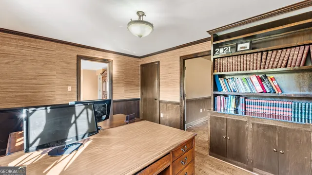 a bedroom with a bed and a book shelf