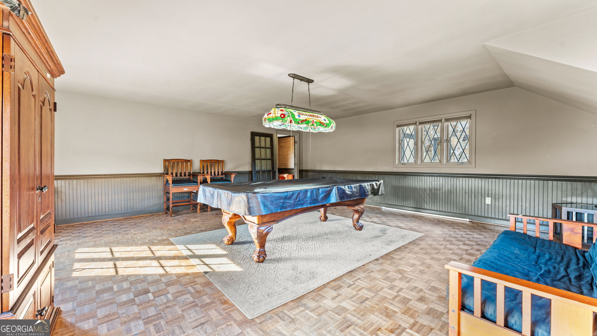 8876 Cave Springs Road Cave Spring, GA 30124 - Photo 17 of 36 a living room with furniture and a chandelier