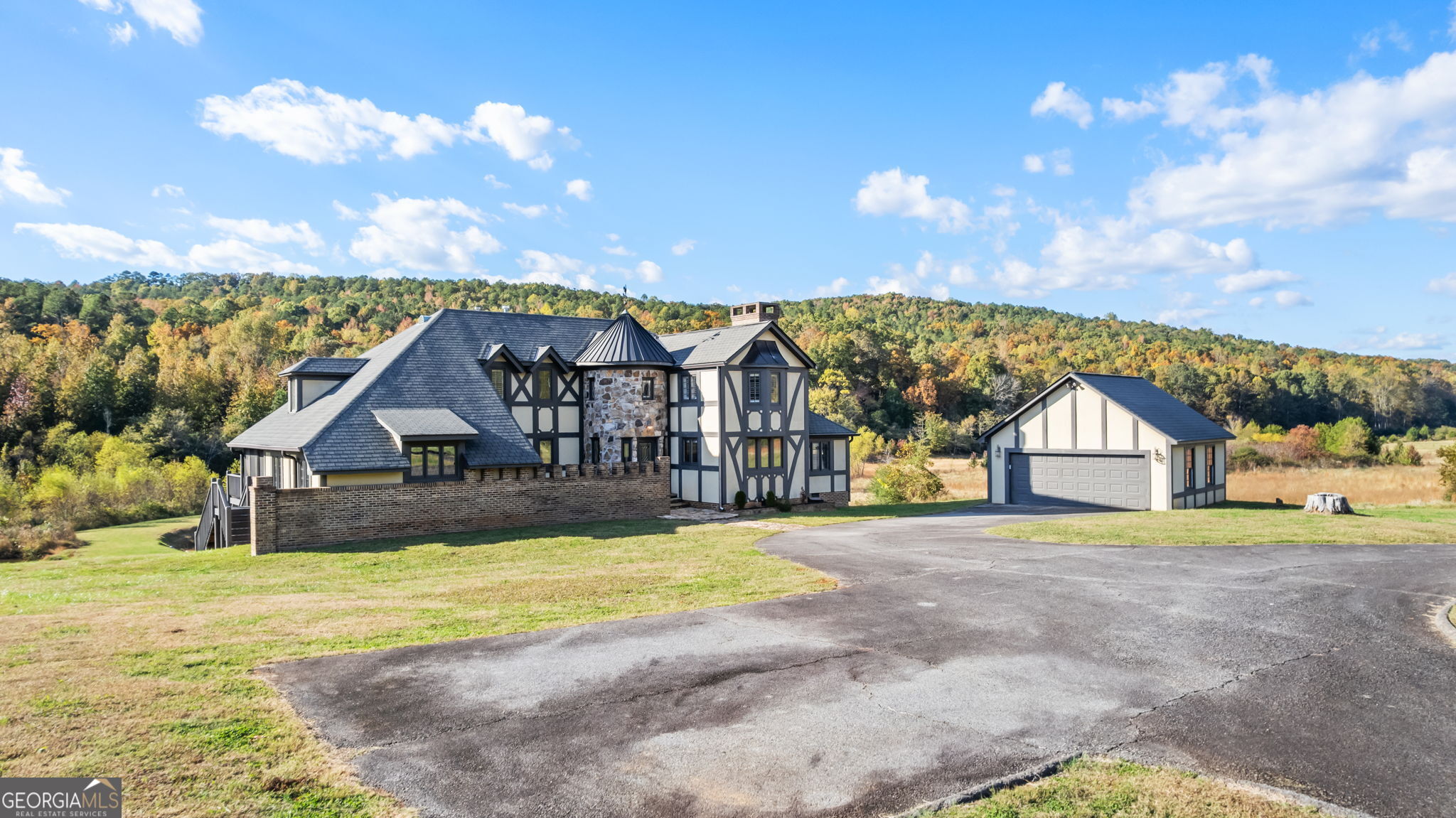 8876 Cave Springs Road Cave Spring, GA 30124 - Photo 2 of 36 a view of house with a big yard and large trees