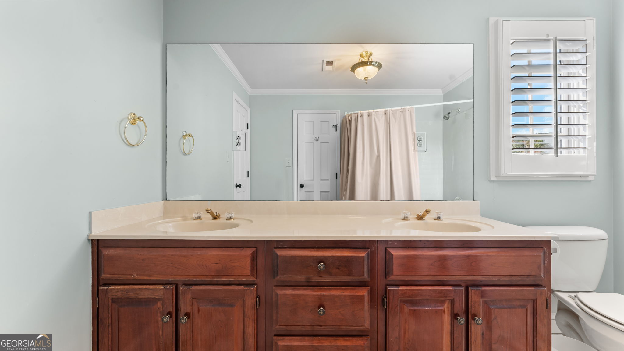8876 Cave Springs Road Cave Spring, GA 30124 - Photo 21 of 36 a bathroom with a sink a vanity and a mirror