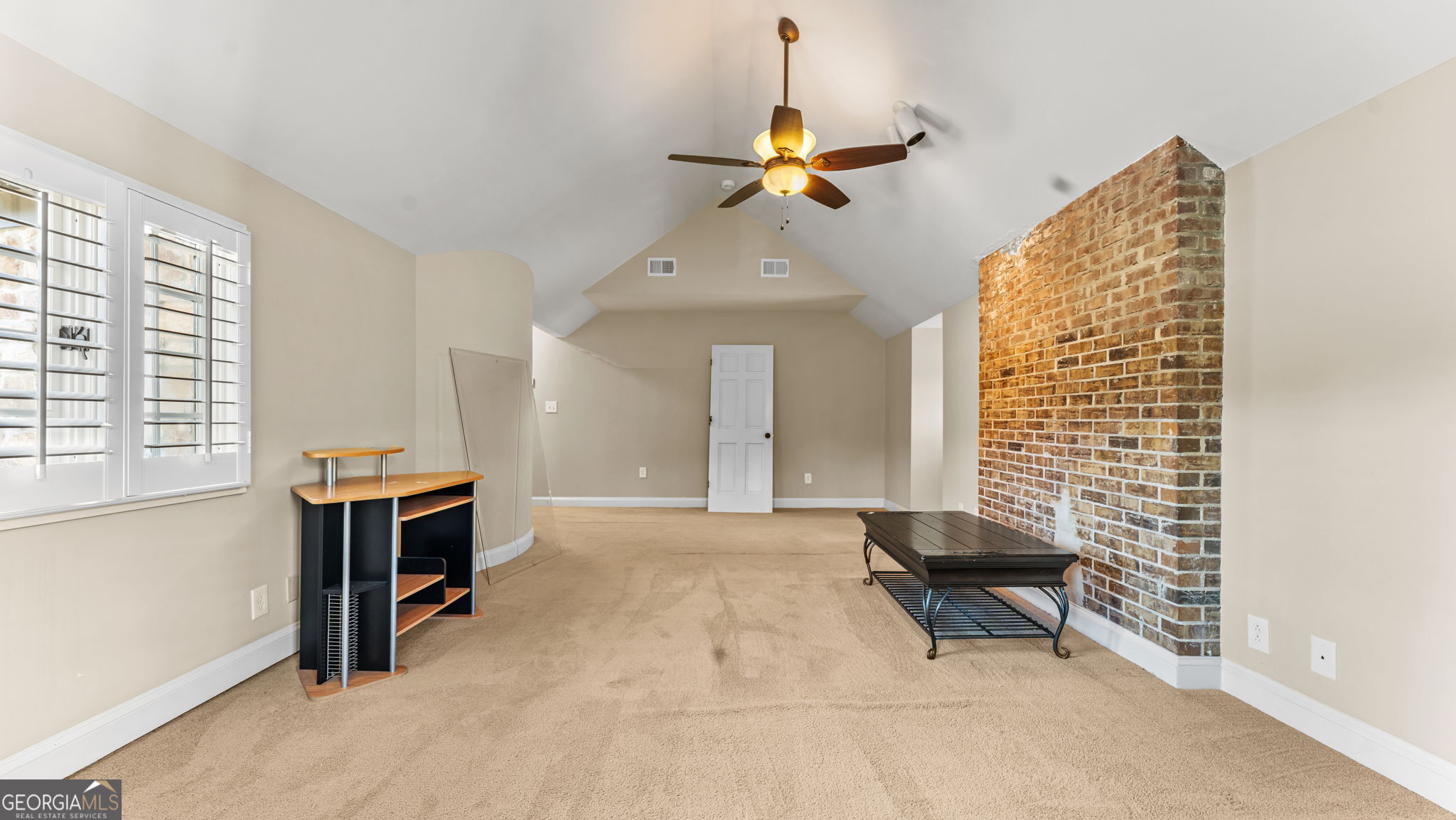 8876 Cave Springs Road Cave Spring, GA 30124 - Photo 23 of 36 a living room with furniture and a chandelier