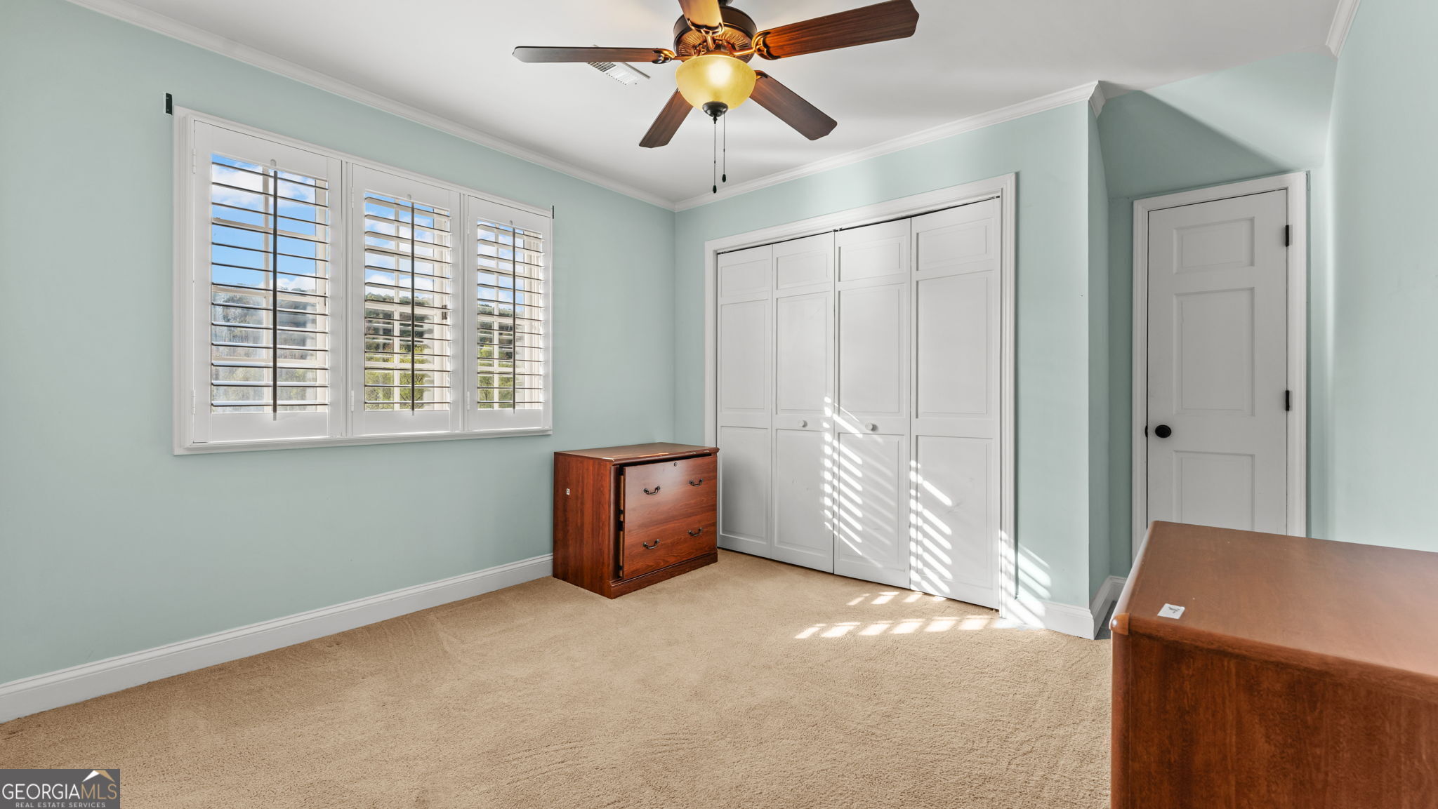 8876 Cave Springs Road Cave Spring, GA 30124 - Photo 27 of 36 a view of a livingroom with a ceiling fan and window