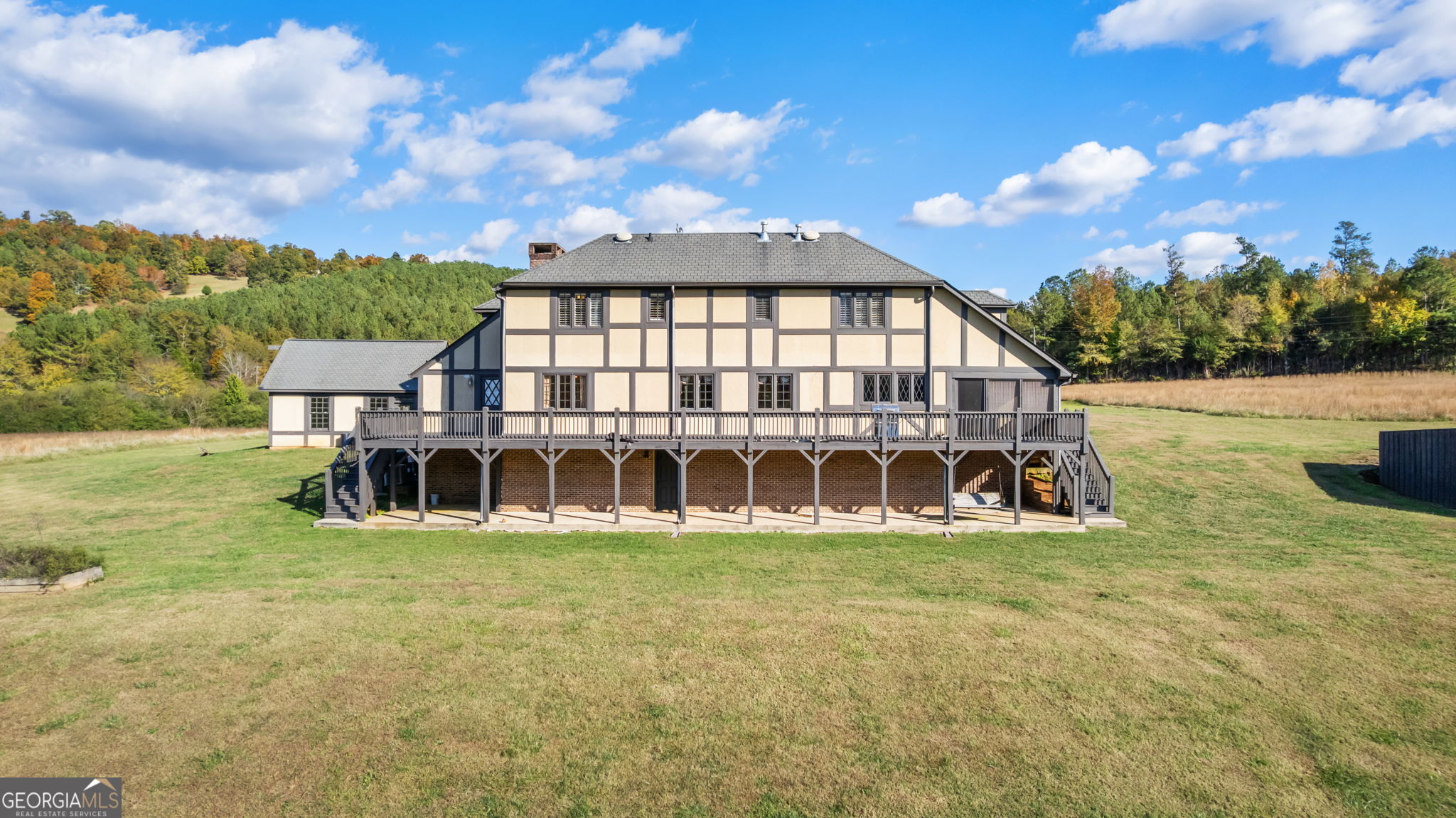 8876 Cave Springs Road Cave Spring, GA 30124 - Photo 29 of 36 a view of a house with yard and sitting area