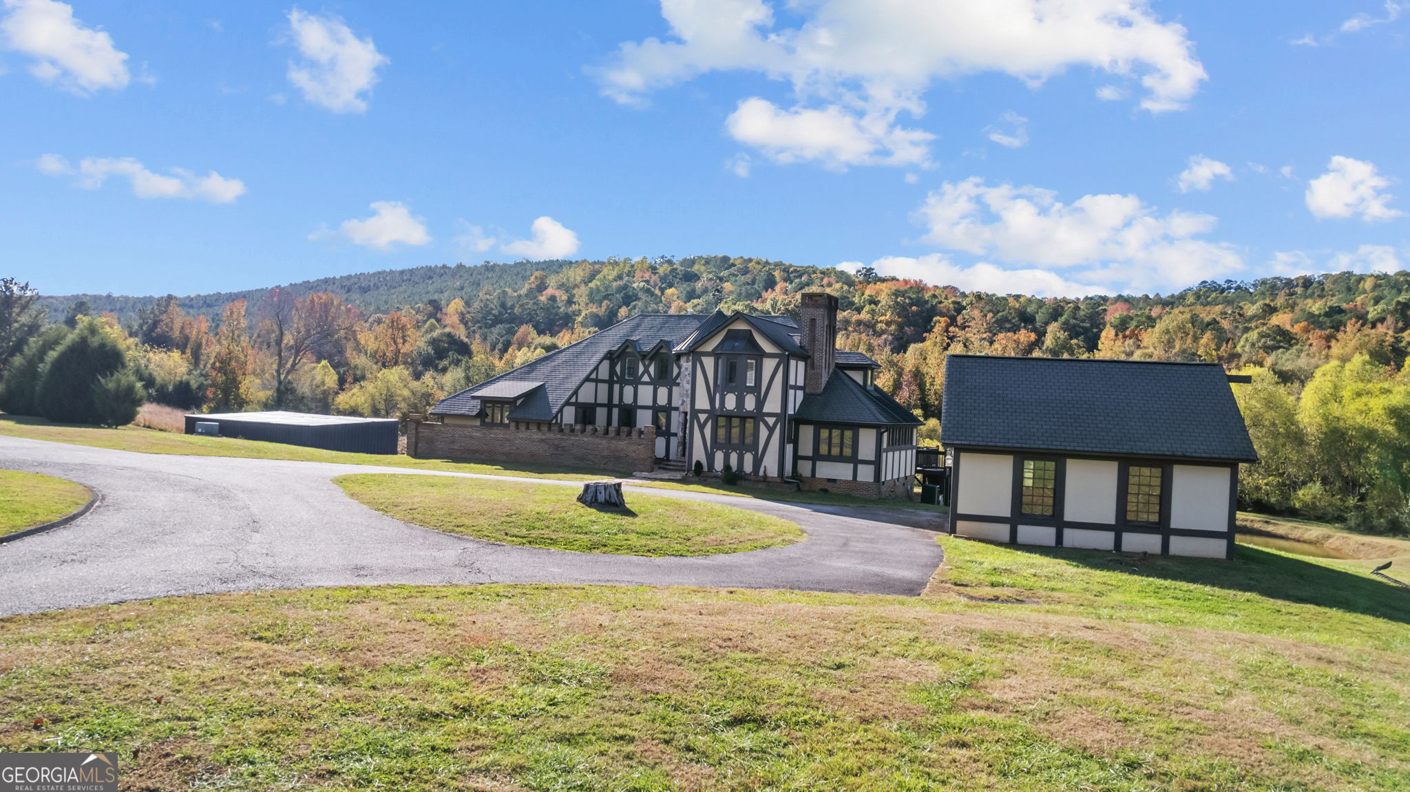 8876 Cave Springs Road Cave Spring, GA 30124 - Photo 3 of 36 a view of a swimming pool with an outdoor seating and a yard