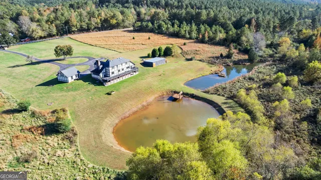 a view of a swimming pool with a yard