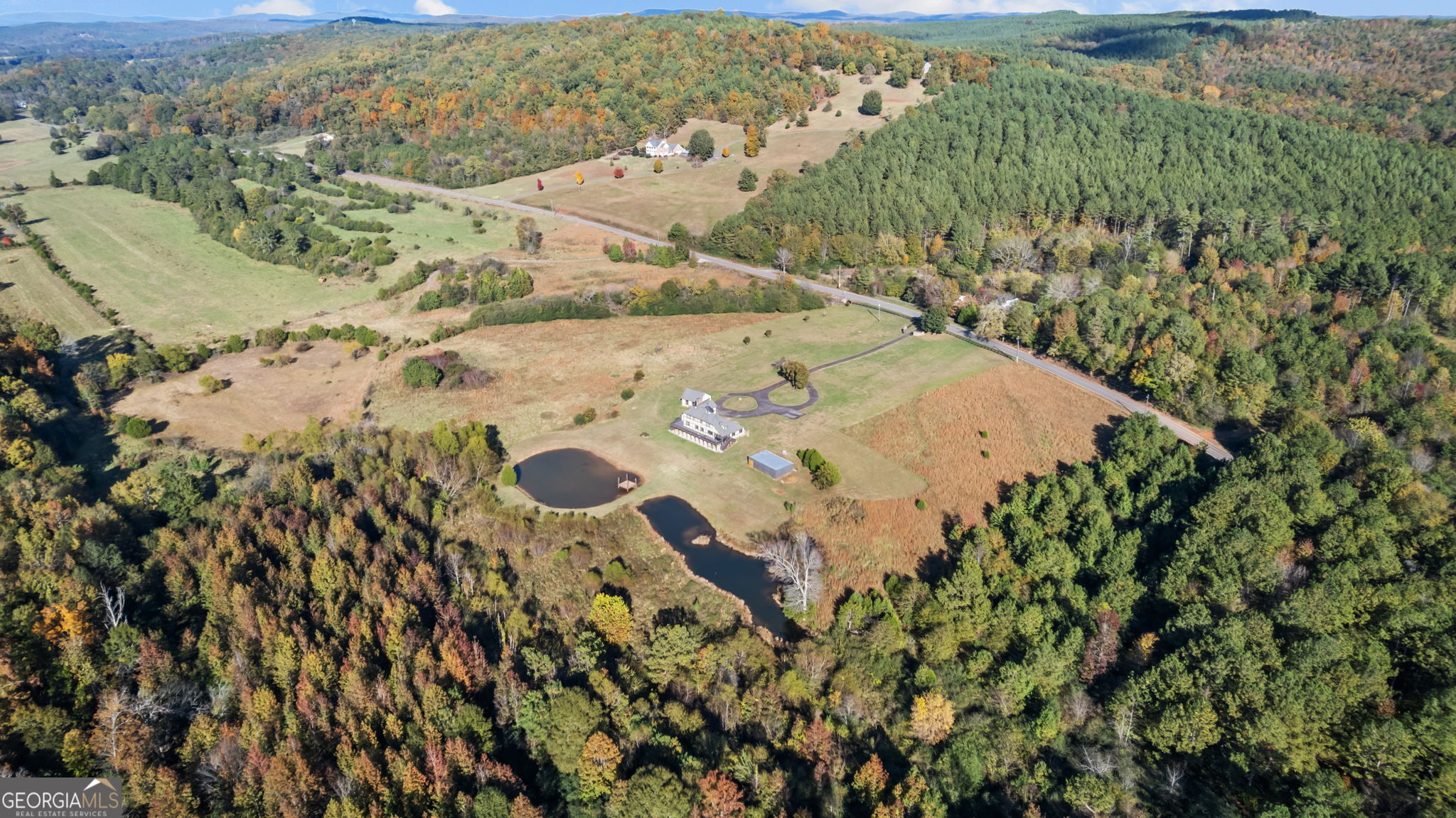 8876 Cave Springs Road Cave Spring, GA 30124 - Photo 35 of 36 an aerial view of a house with a yard