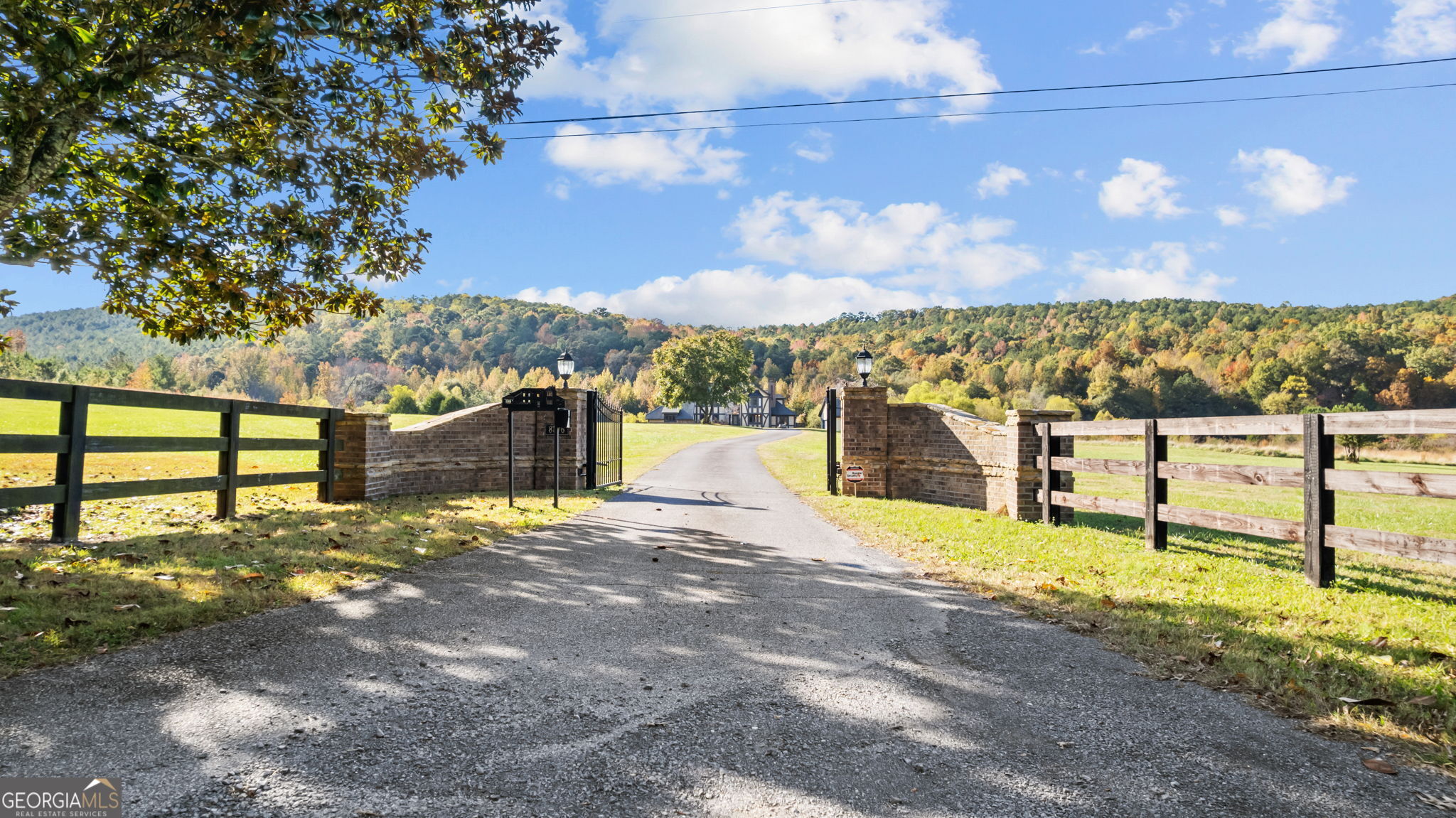 8876 Cave Springs Road Cave Spring, GA 30124 - Photo 36 of 36 a view of a lake with a building in the background