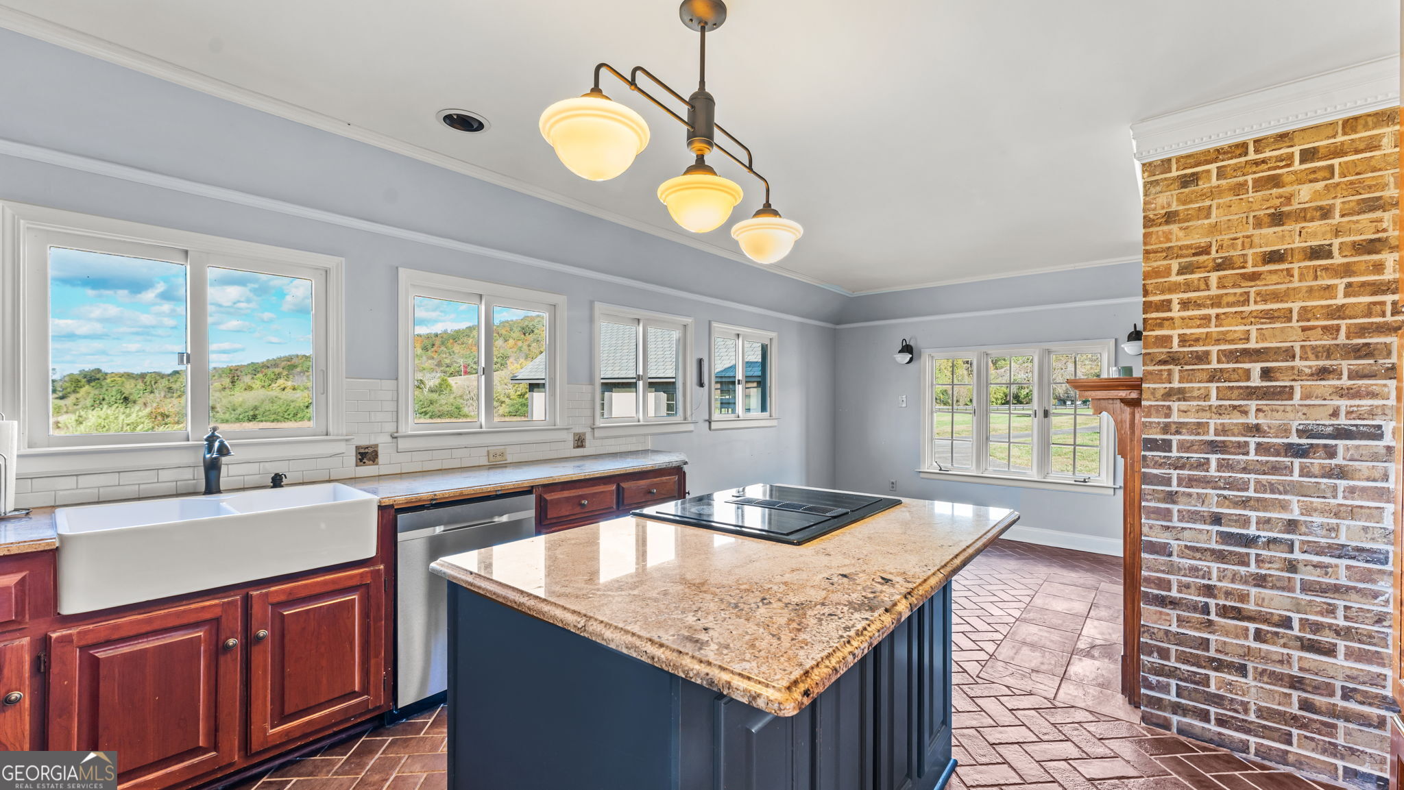 8876 Cave Springs Road Cave Spring, GA 30124 - Photo 5 of 36 a kitchen with a sink granite counter tops and a window