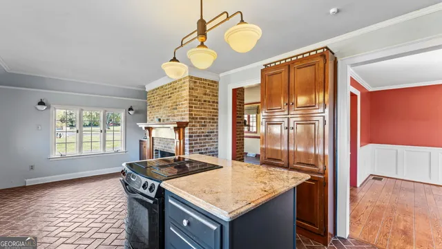 a kitchen with a stove and a refrigerator