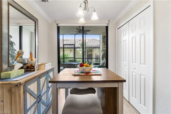 a view of a dining room with furniture window and outside view