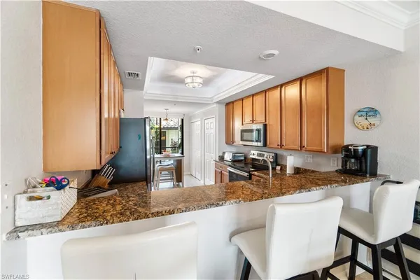a kitchen with a sink and a large window