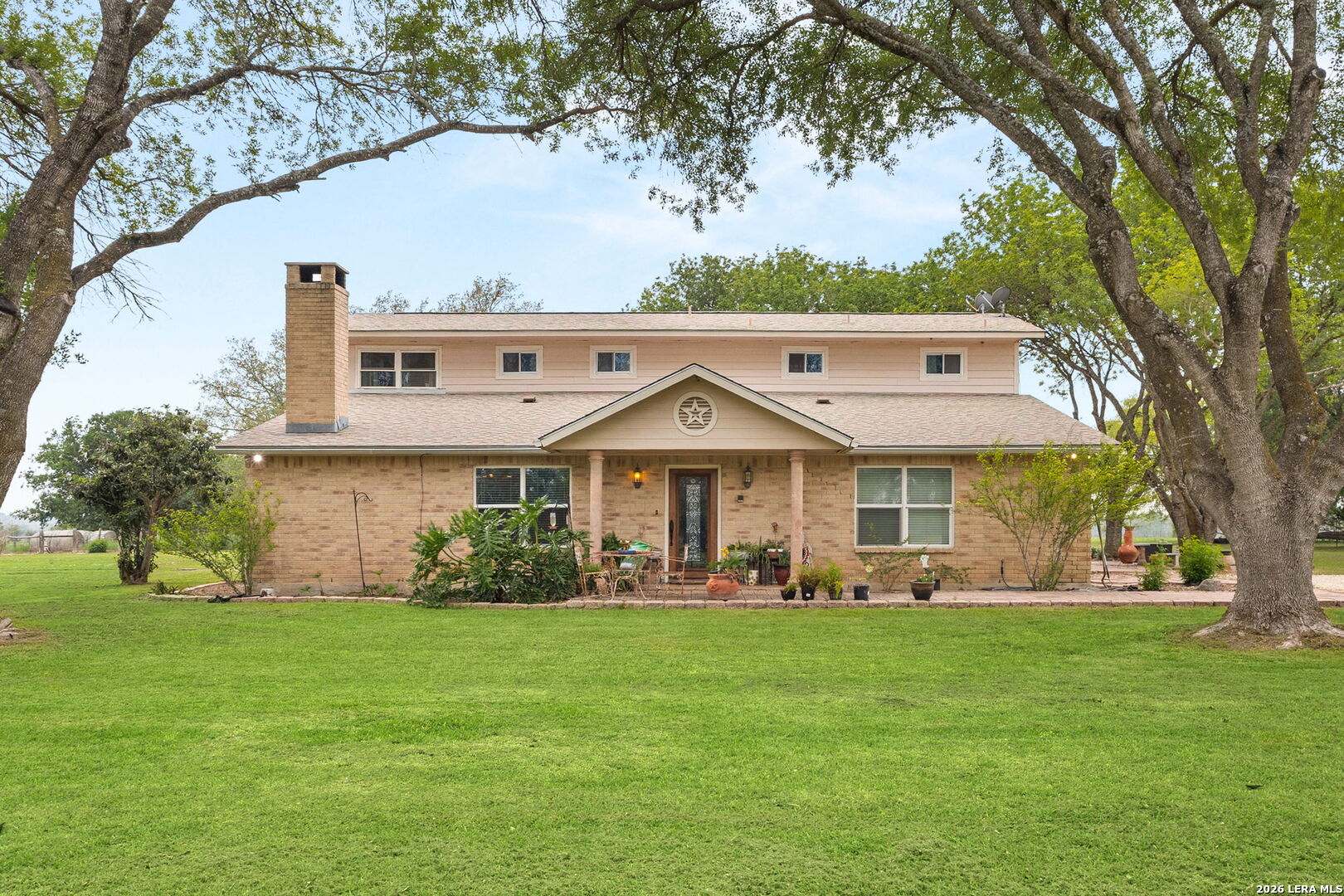 350 Ullrich Road Marion, TX 78124 - Photo 1 of 43 a view of a big house with a big yard and large trees
