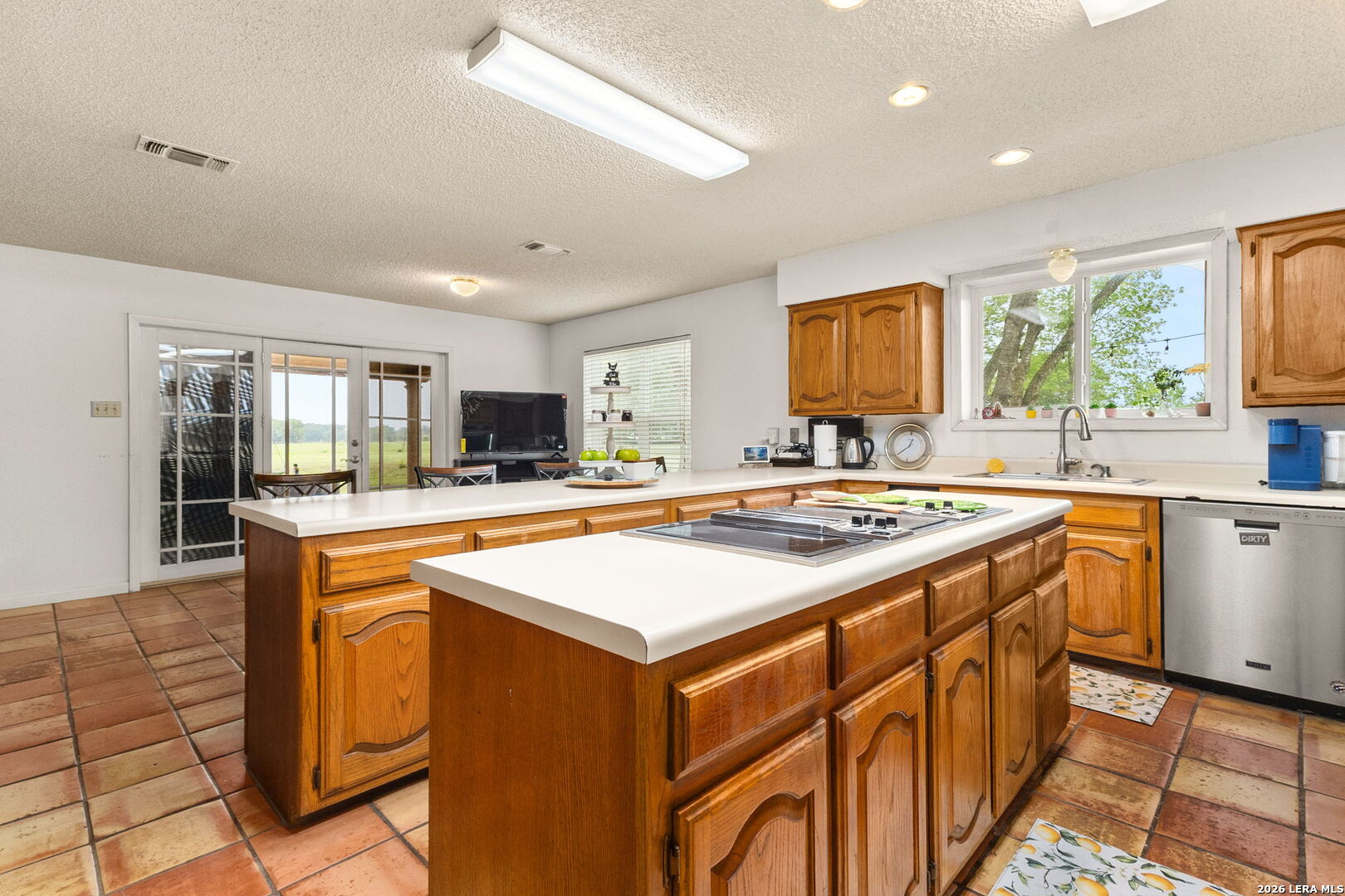 350 Ullrich Road Marion, TX 78124 - Photo 11 of 43 a kitchen with stainless steel appliances granite countertop a sink and a stove