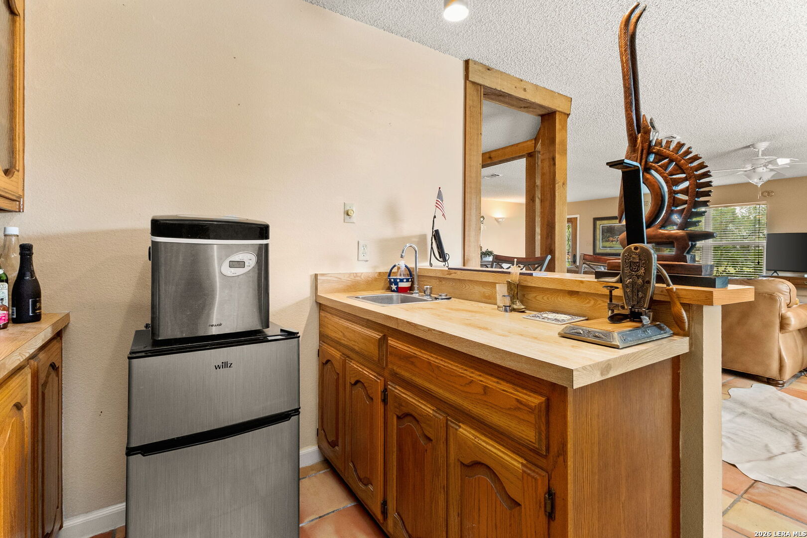 350 Ullrich Road Marion, TX 78124 - Photo 15 of 43 a kitchen with a sink and a refrigerator