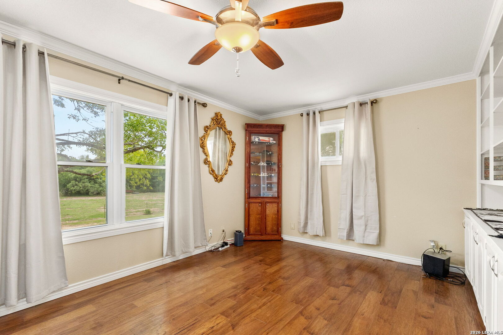 350 Ullrich Road Marion, TX 78124 - Photo 20 of 43 a view of empty room with wooden floor and fan