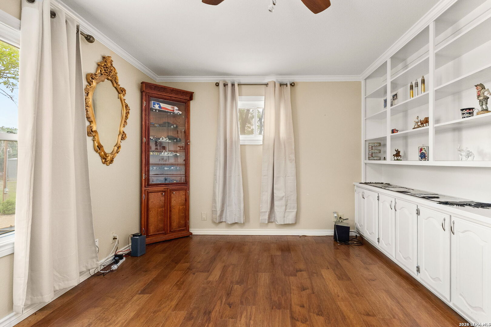 350 Ullrich Road Marion, TX 78124 - Photo 21 of 43 a view of a hallway with wooden floor and cabinet
