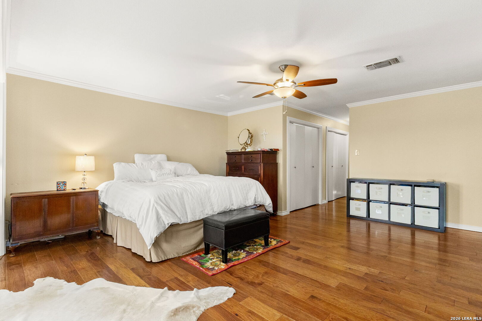 350 Ullrich Road Marion, TX 78124 - Photo 25 of 43 a spacious bedroom with a bed and a chandelier
