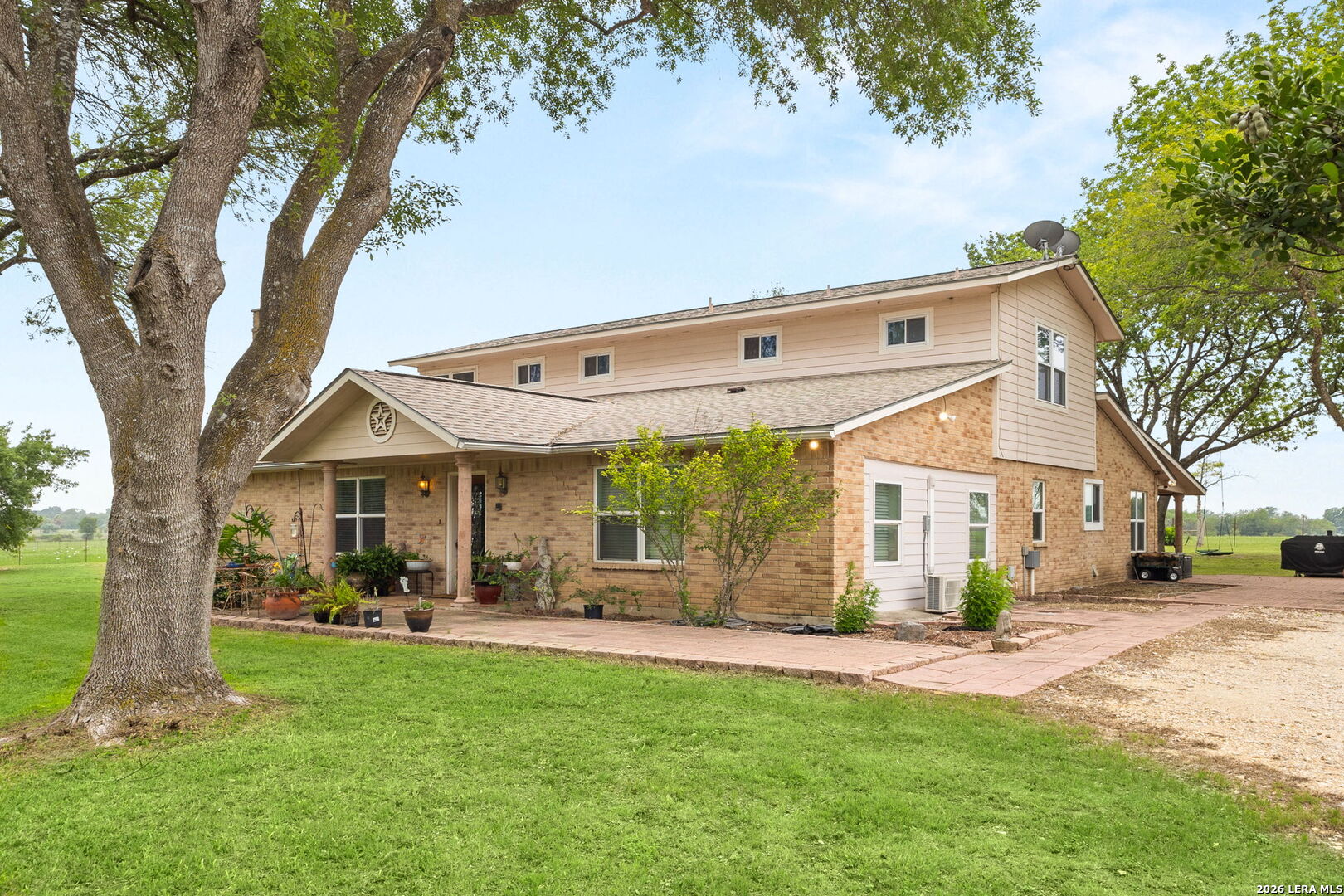 350 Ullrich Road Marion, TX 78124 - Photo 28 of 43 a front view of a house with a garden and trees