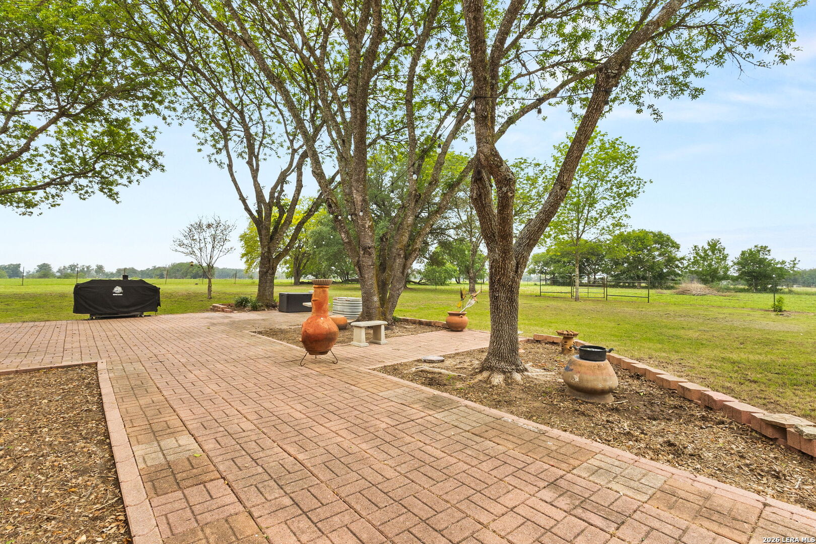 350 Ullrich Road Marion, TX 78124 - Photo 29 of 43 a view of a swimming pool with a patio and garden