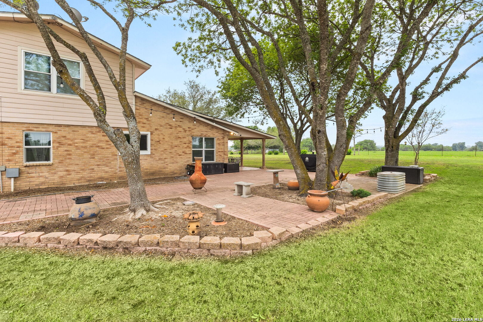 350 Ullrich Road Marion, TX 78124 - Photo 34 of 43 a view of a backyard with a garden and tree