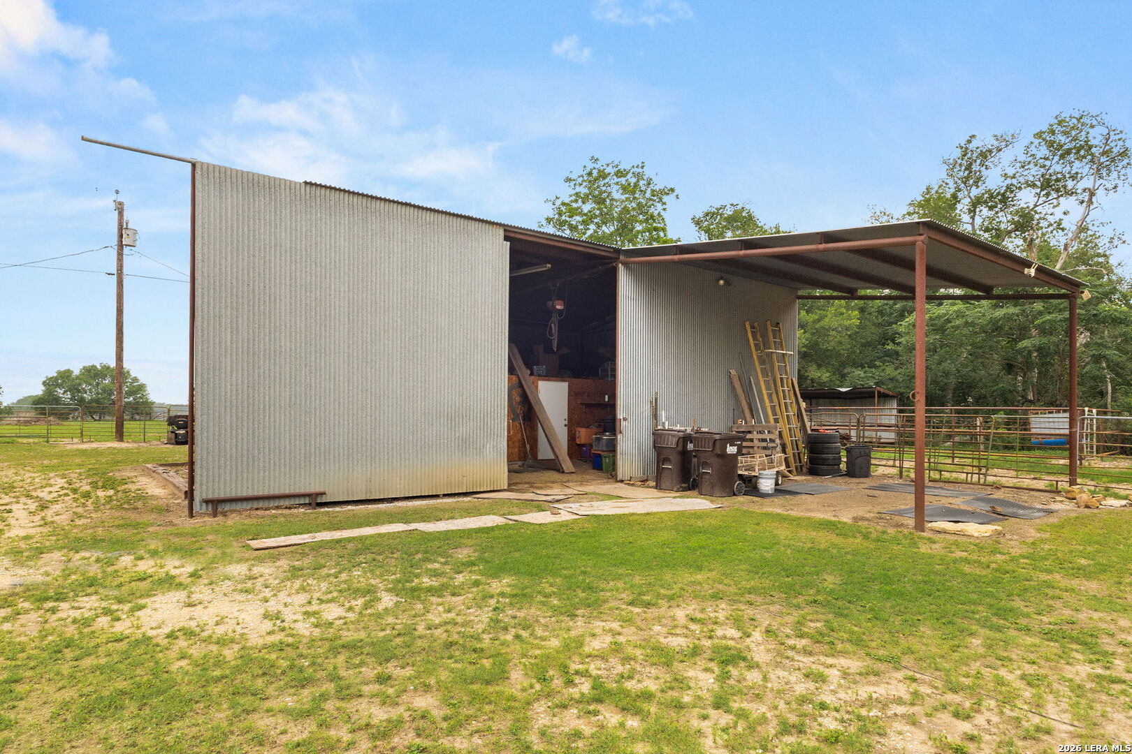 350 Ullrich Road Marion, TX 78124 - Photo 39 of 43 a view of a backyard with table and chairs and potted plants