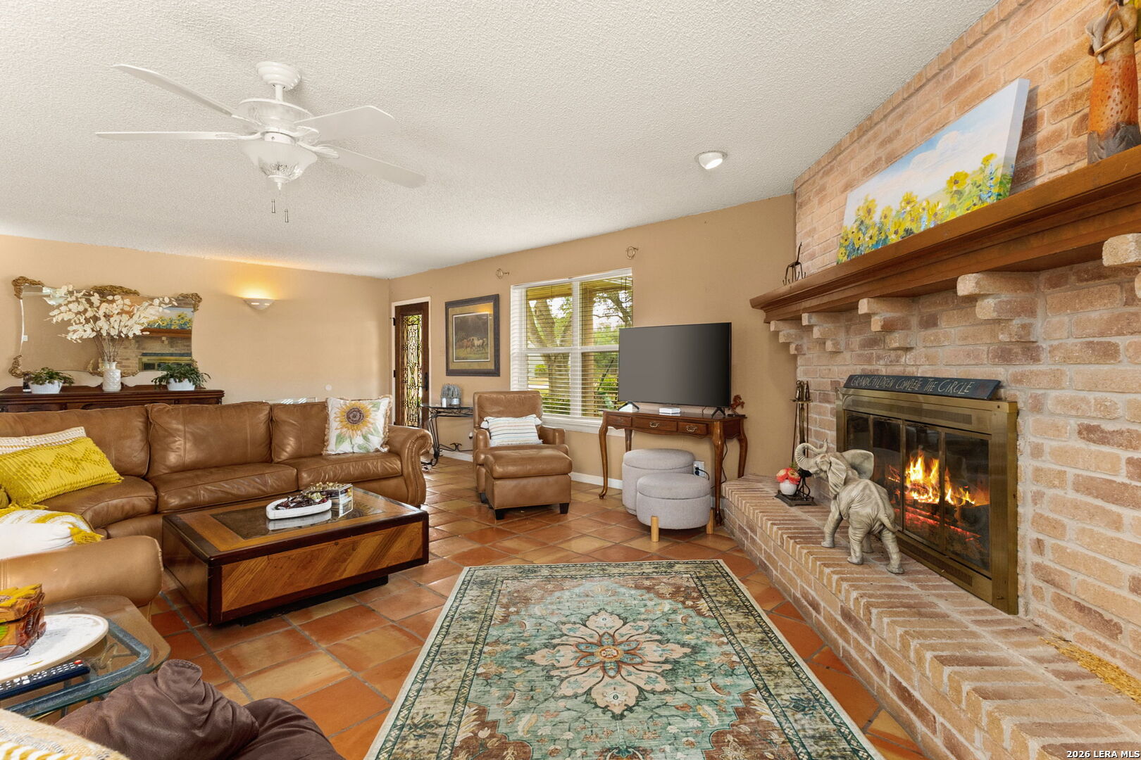 350 Ullrich Road Marion, TX 78124 - Photo 5 of 43 a living room with furniture and a fireplace
