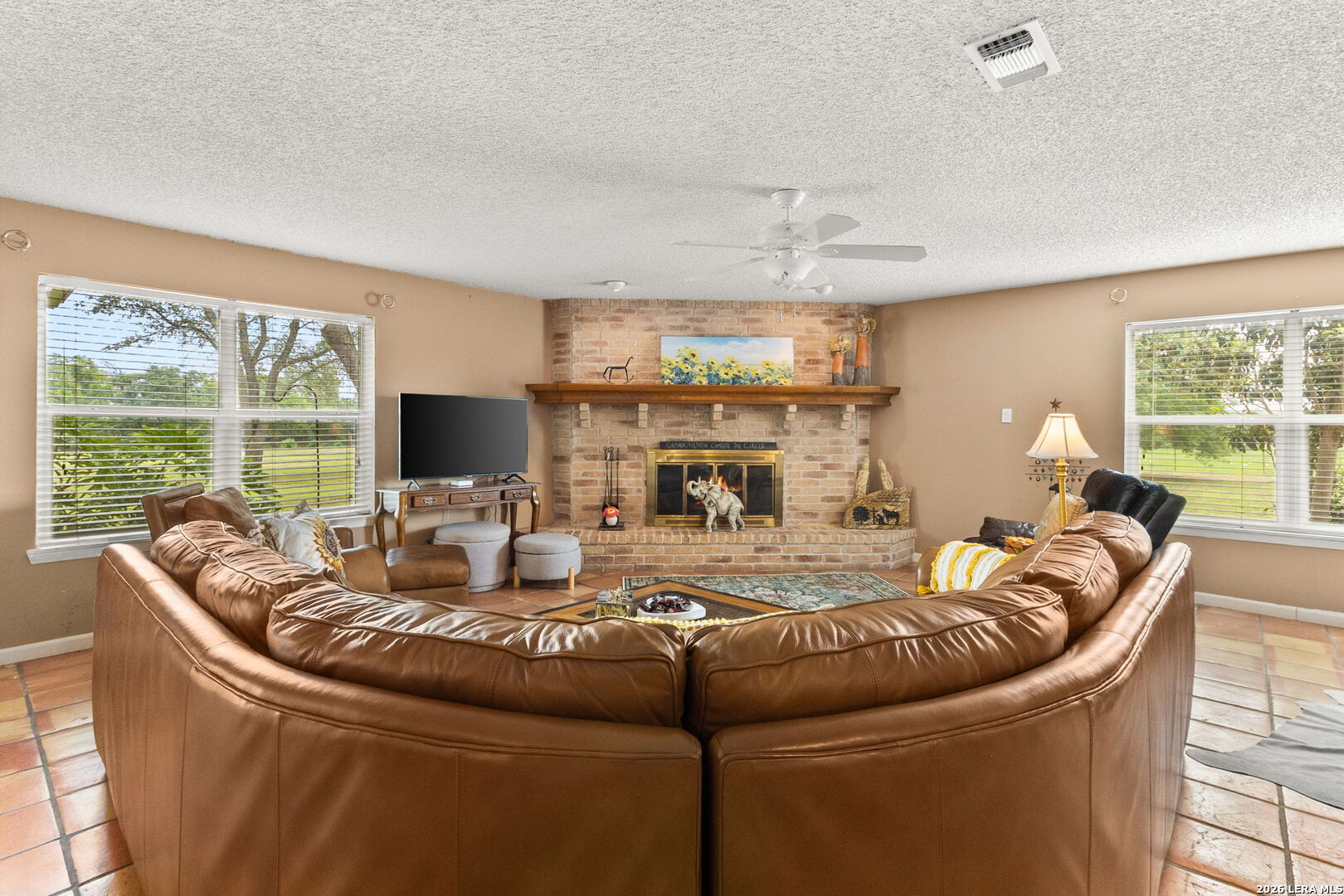 350 Ullrich Road Marion, TX 78124 - Photo 6 of 43 a living room with fireplace furniture and a large window