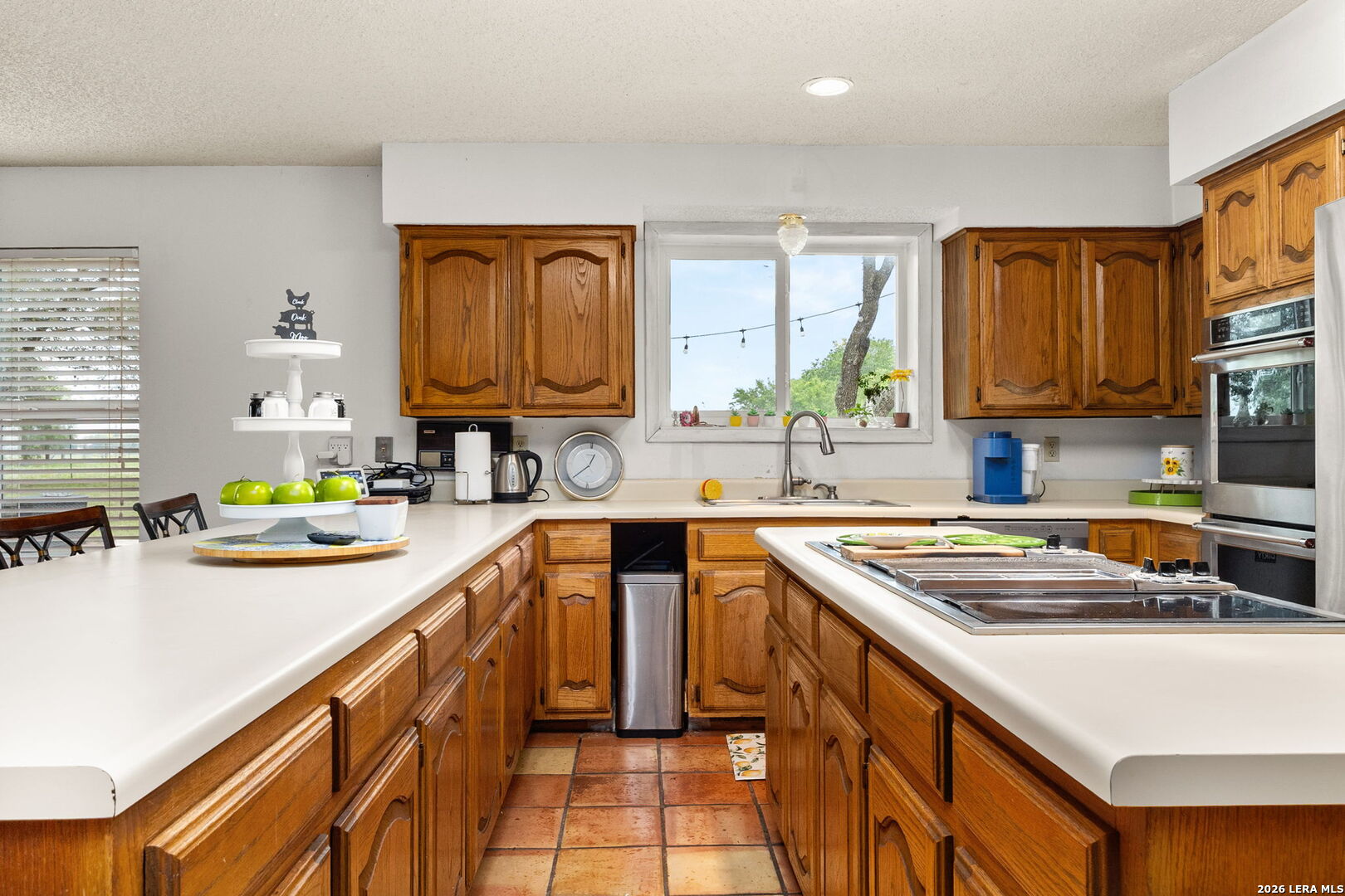 350 Ullrich Road Marion, TX 78124 - Photo 7 of 43 a kitchen with stainless steel appliances granite countertop a sink stove and cabinets