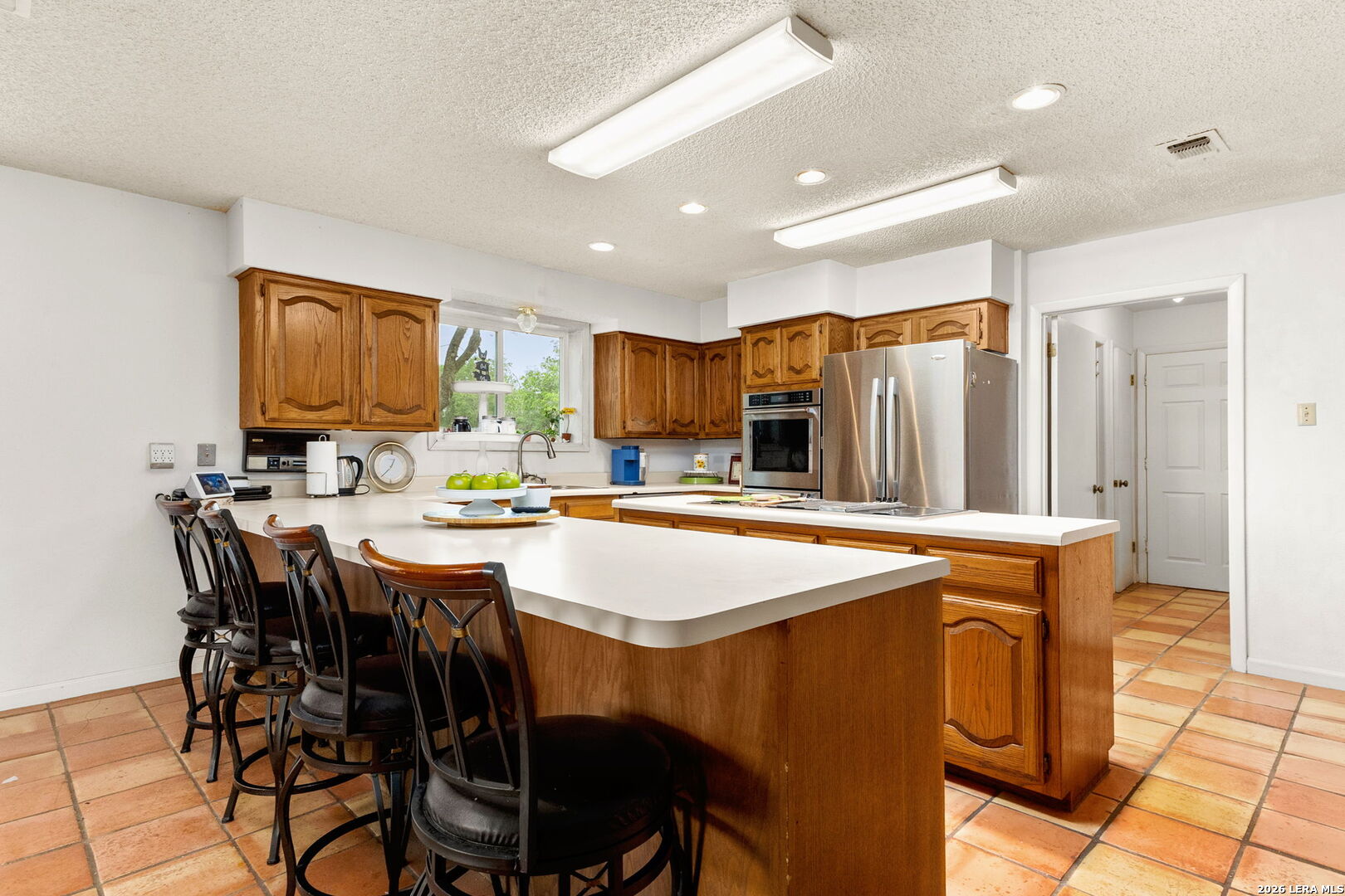 350 Ullrich Road Marion, TX 78124 - Photo 10 of 43 a kitchen with stainless steel appliances granite countertop a dining table chairs and granite counter tops