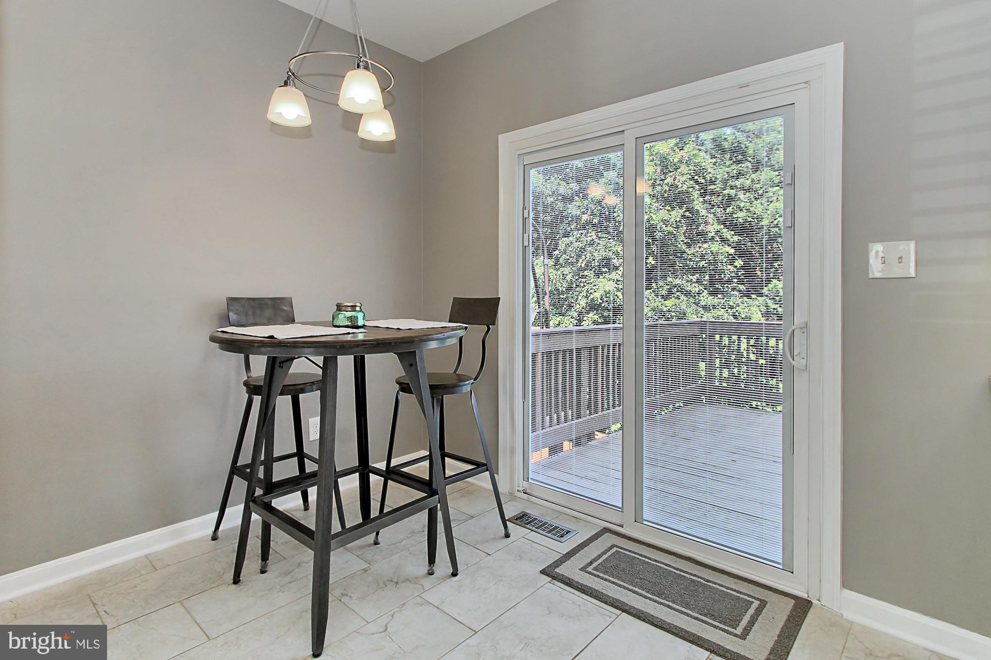 6461 McCoy Road Centreville, VA 20121 - Photo 14 of 31 Warm tile floors and pendant lighting