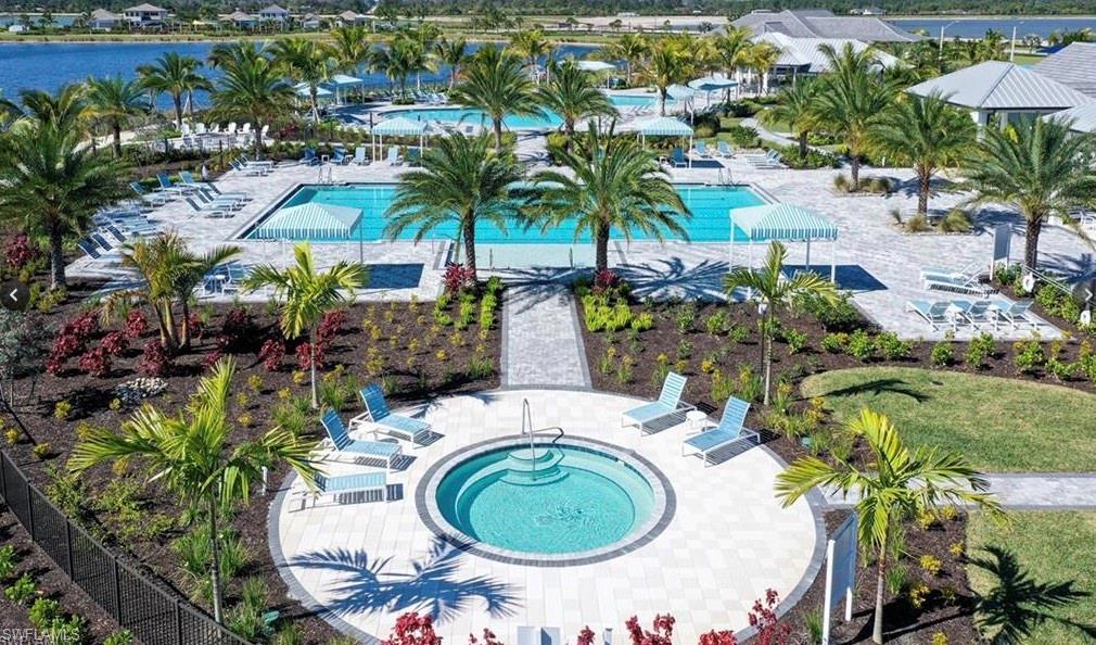 3998 Perseus Street Naples, FL 34120 - Photo 22 of 26 Drone / aerial view of a pool