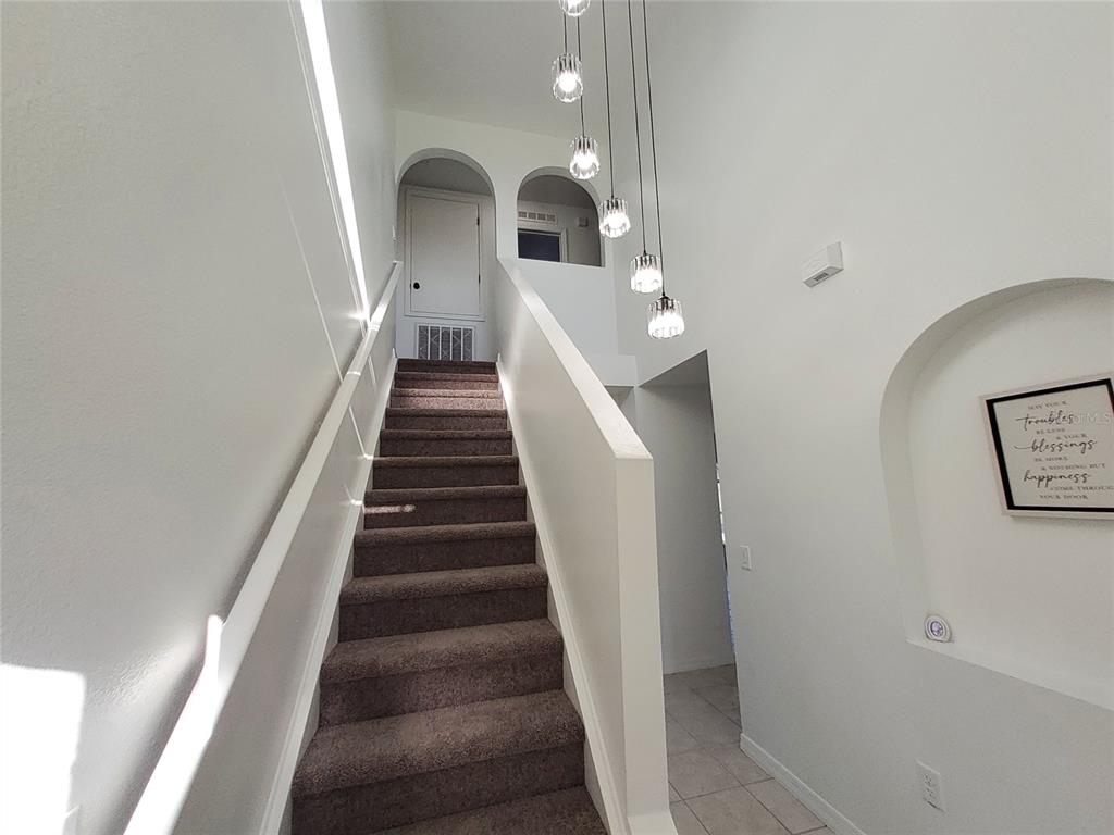 509 Ridges Drive Dundee, FL 33838 - Photo 13 of 33 a view of entryway and hall with wooden floor