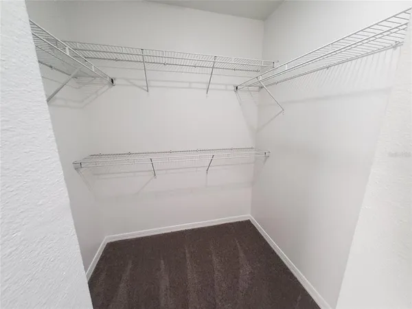 a view of a room with racks on the wall