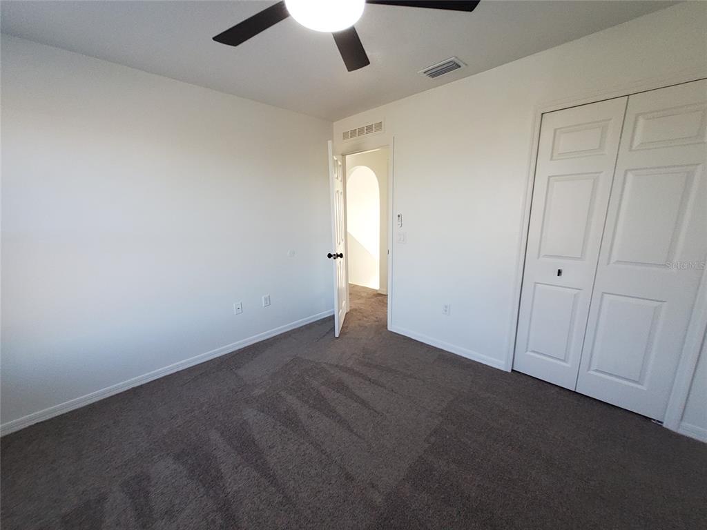 509 Ridges Drive Dundee, FL 33838 - Photo 27 of 33 an empty room with a empty space and a ceiling fan