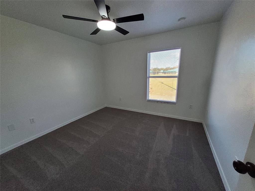 509 Ridges Drive Dundee, FL 33838 - Photo 28 of 33 an empty room with a window and a fan