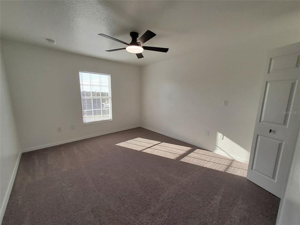 509 Ridges Drive Dundee, FL 33838 - Photo 29 of 33 a view of an empty room with a window