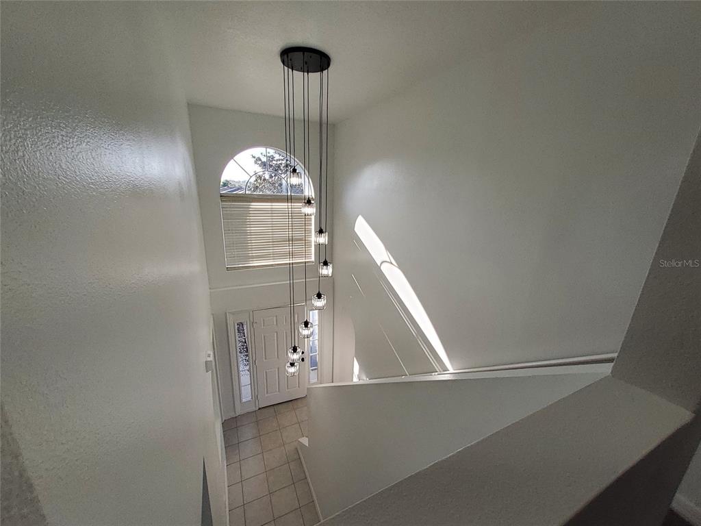 509 Ridges Drive Dundee, FL 33838 - Photo 30 of 33 a view of a hallway with a chandelier