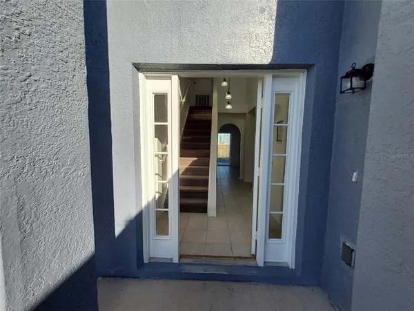 view of a hallway with wooden floor and staircase