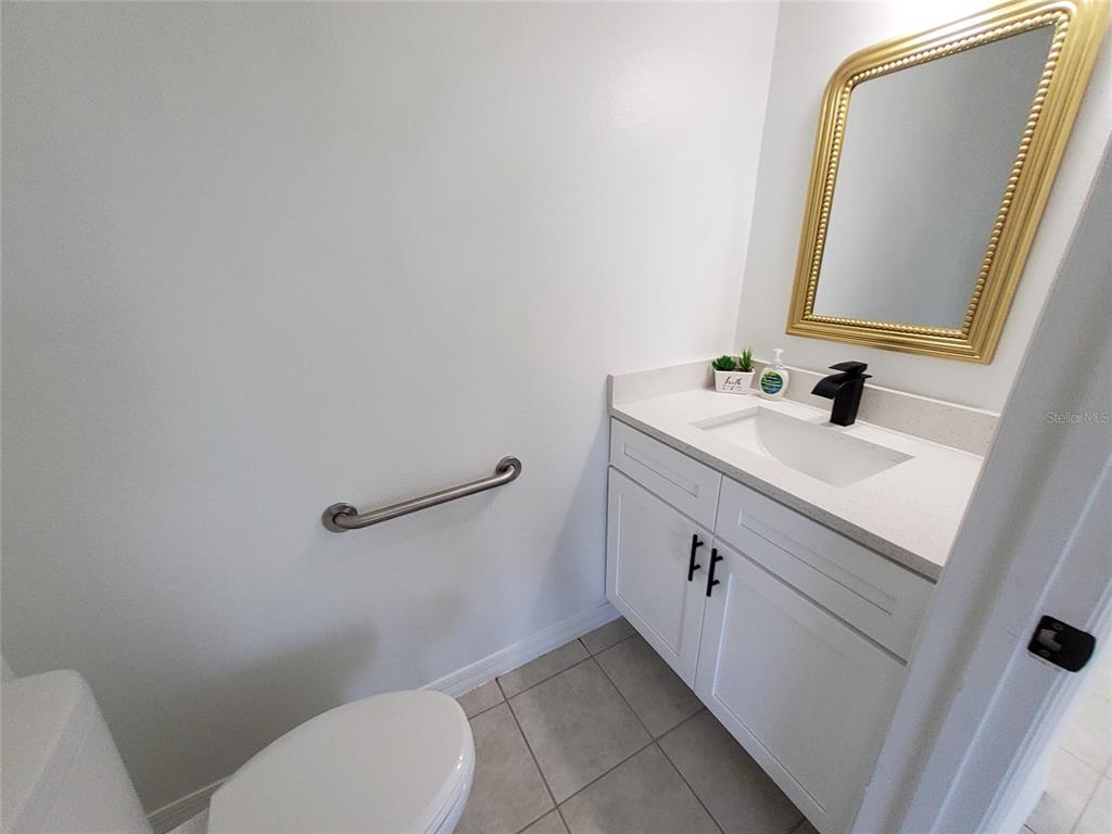 509 Ridges Drive Dundee, FL 33838 - Photo 9 of 33 a bathroom with a toilet sink and mirror